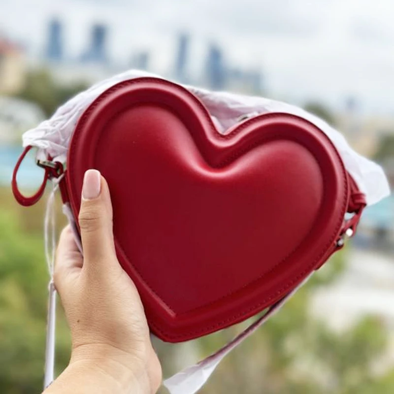Bolsos Arlene de moda con forma de corazón para mujer bolsos y carteras de diseñador de lujo novedad 2026 minibolso de hombro bajo el brazo con relieve en PU alta calidad envío gratis Llega el envío rápido