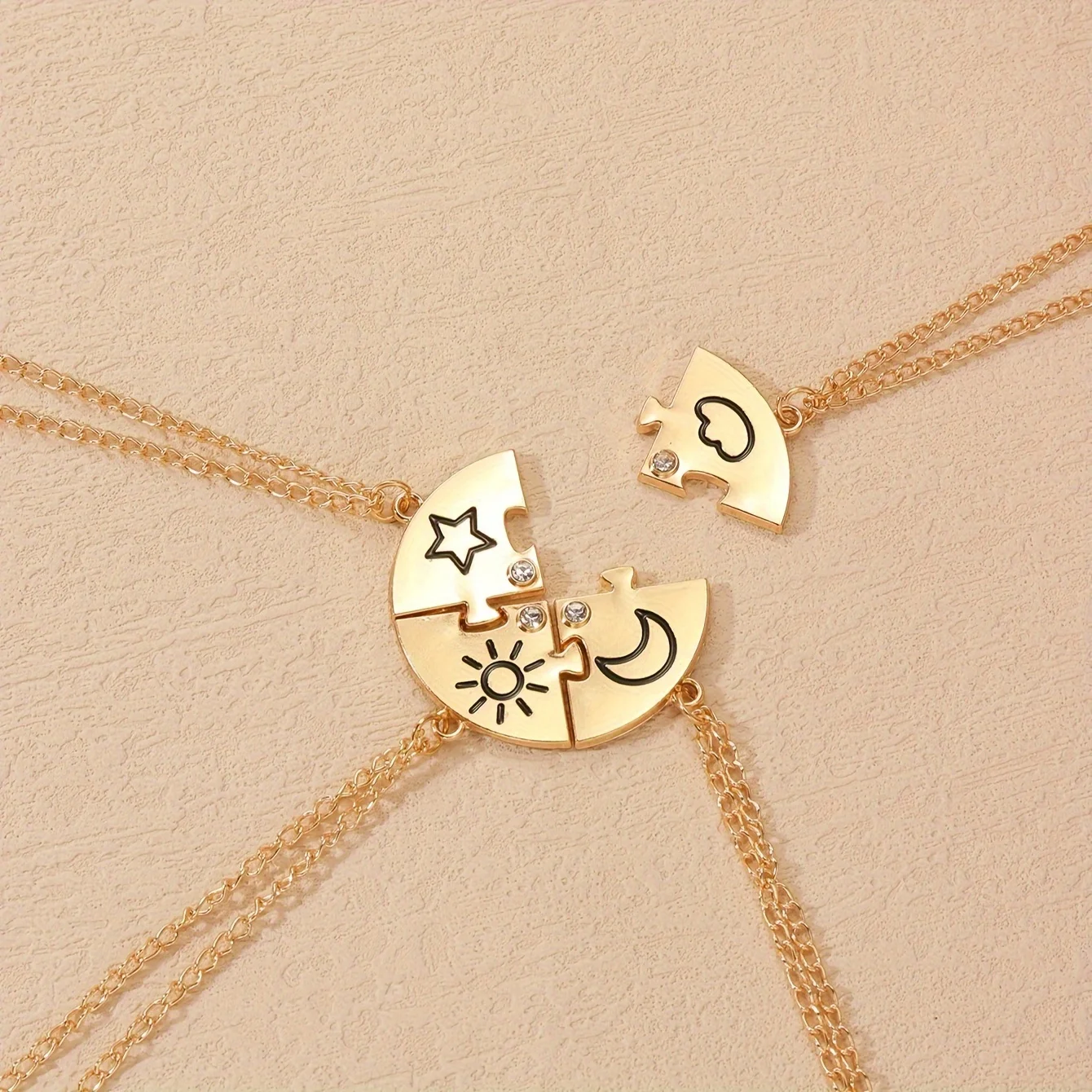 A Set of Four Puzzle Necklaces Featuring Sun, Stars, And Clouds, Designed in a Stylish And Minimalist Way for Friends And Couples