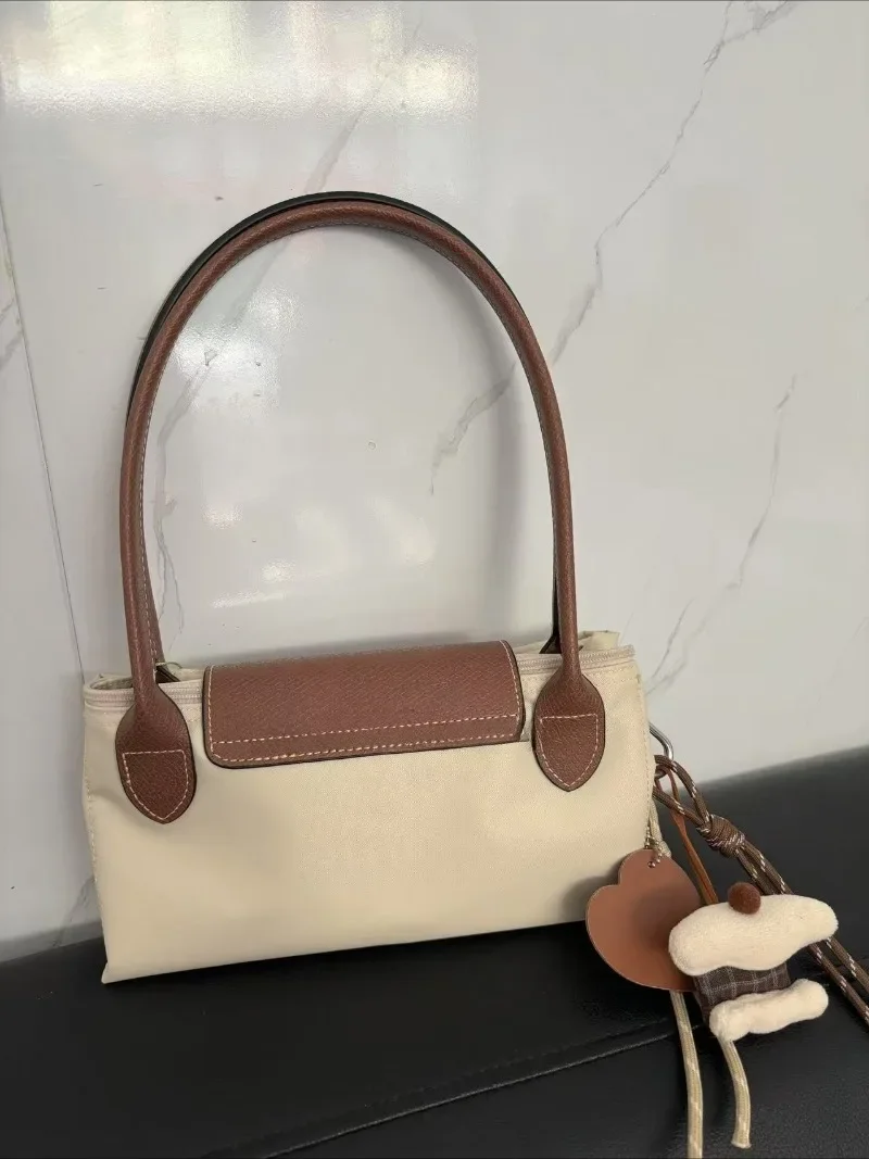

2025 Popular fashion multifunctional large capacity women's handbag shoulder bag Y2K classic foldable classic pendant integrated