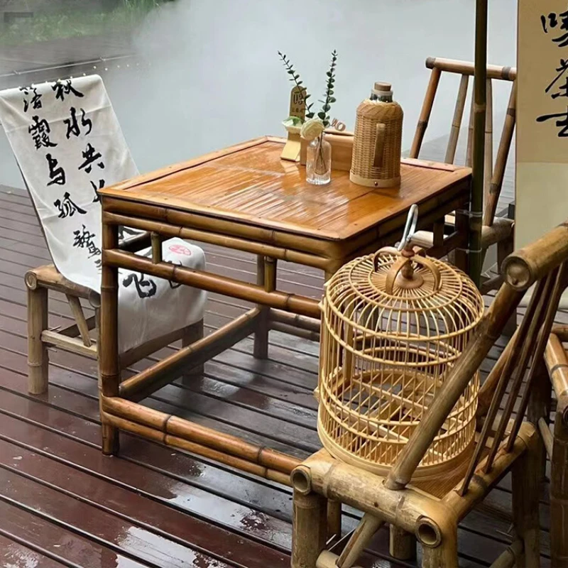 A combination of bamboo tables and chairs for brewing tea in a furnace, outdoor courtyard bamboo tables, Chinese retro style