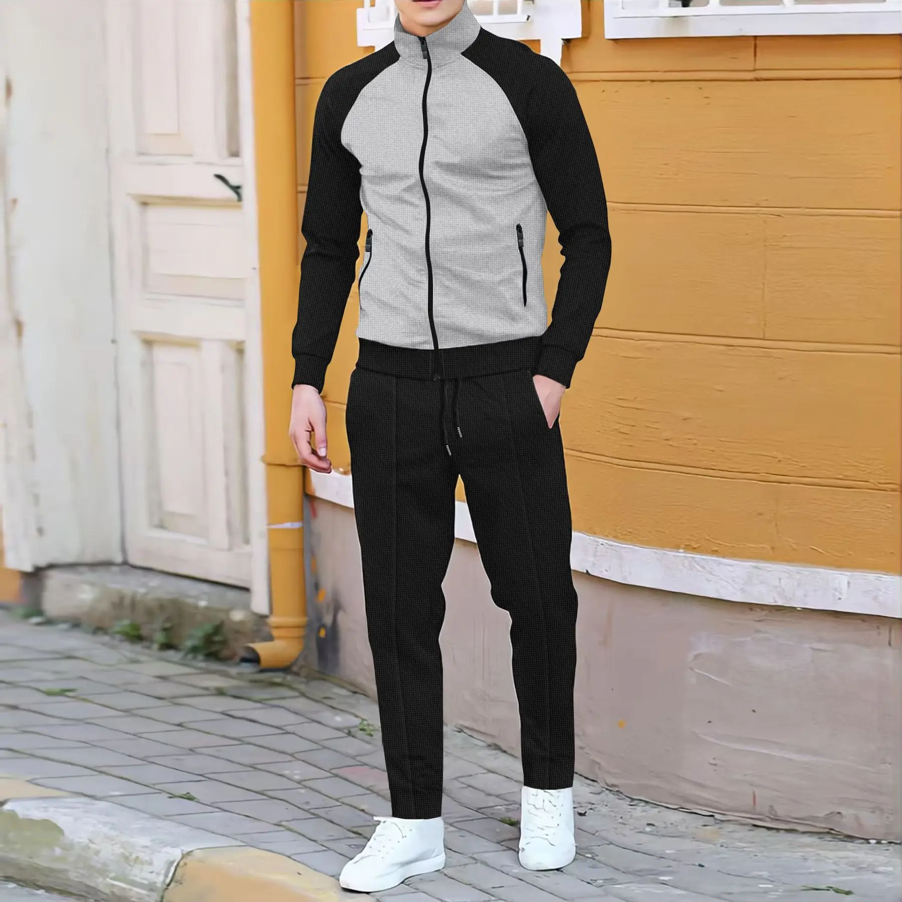 Abito casual da uomo primaverile e autunnale con contrasto di colore alla moda con giacca a collo alto con manica a rotatore + pantaloni sportivi