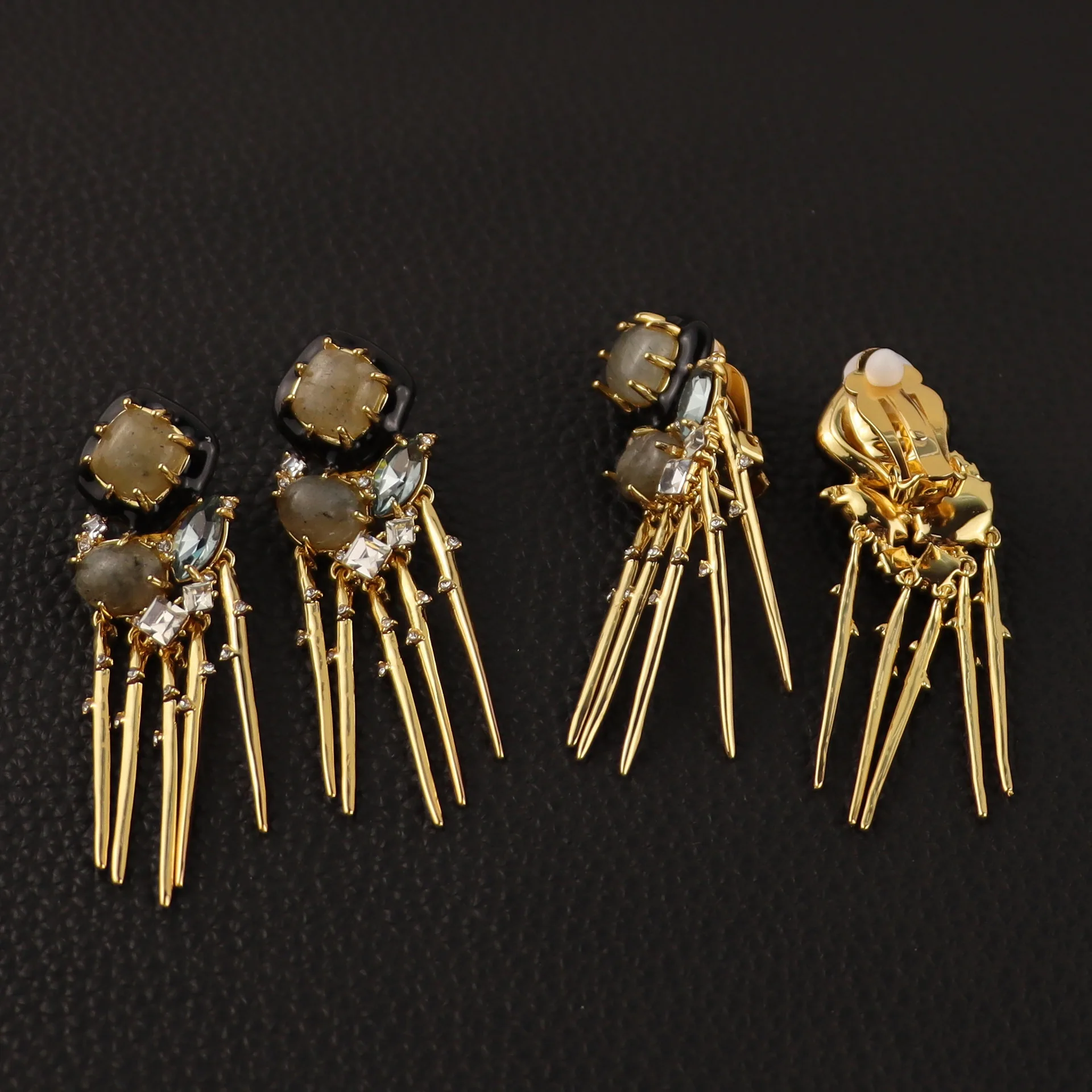 

Designed with a refined geometric fringe set with natural stone earring clips