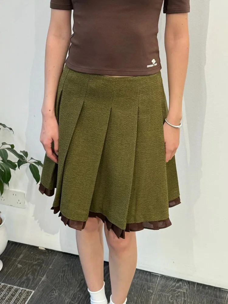 

The 2025 autumn/winter new elegant and stylish half skirt with contrasting colors and pleated skirt trims for women