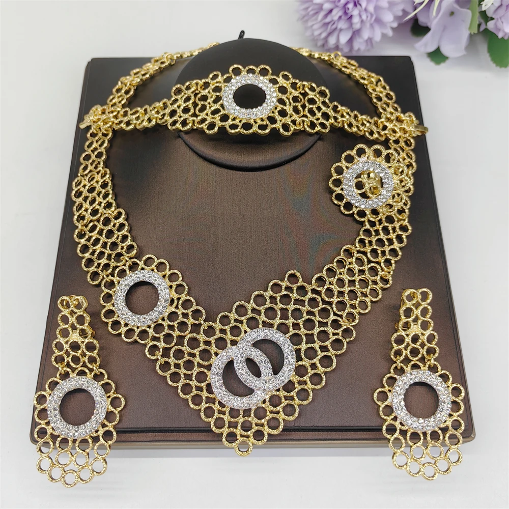 

Африканские комплекты украшений для женщин, золотистого цвета, с кристаллами, свадебные аксессуары, нигерийский комплект с цветочным узором, ожерелье и серьги.