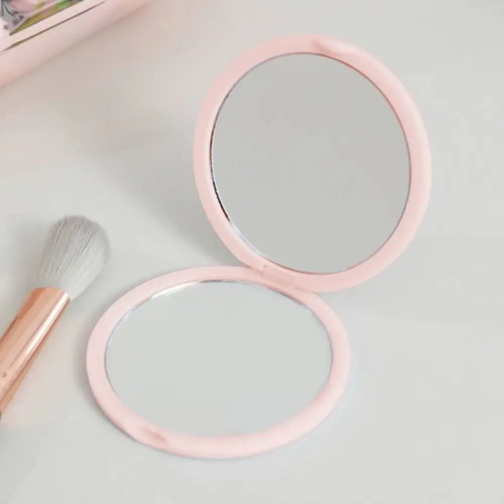 Semplice Mini specchio tenuto in mano specchio per il trucco portatile a doppia faccia specchio tascabile in plastica pieghevole da donna