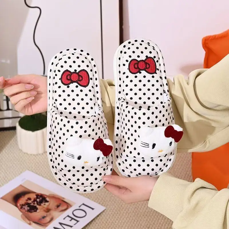 

real photos 2026 autumn winter new Sanrio hello kitty caroon doll cute lovely red bow black white women warm cotton slippers