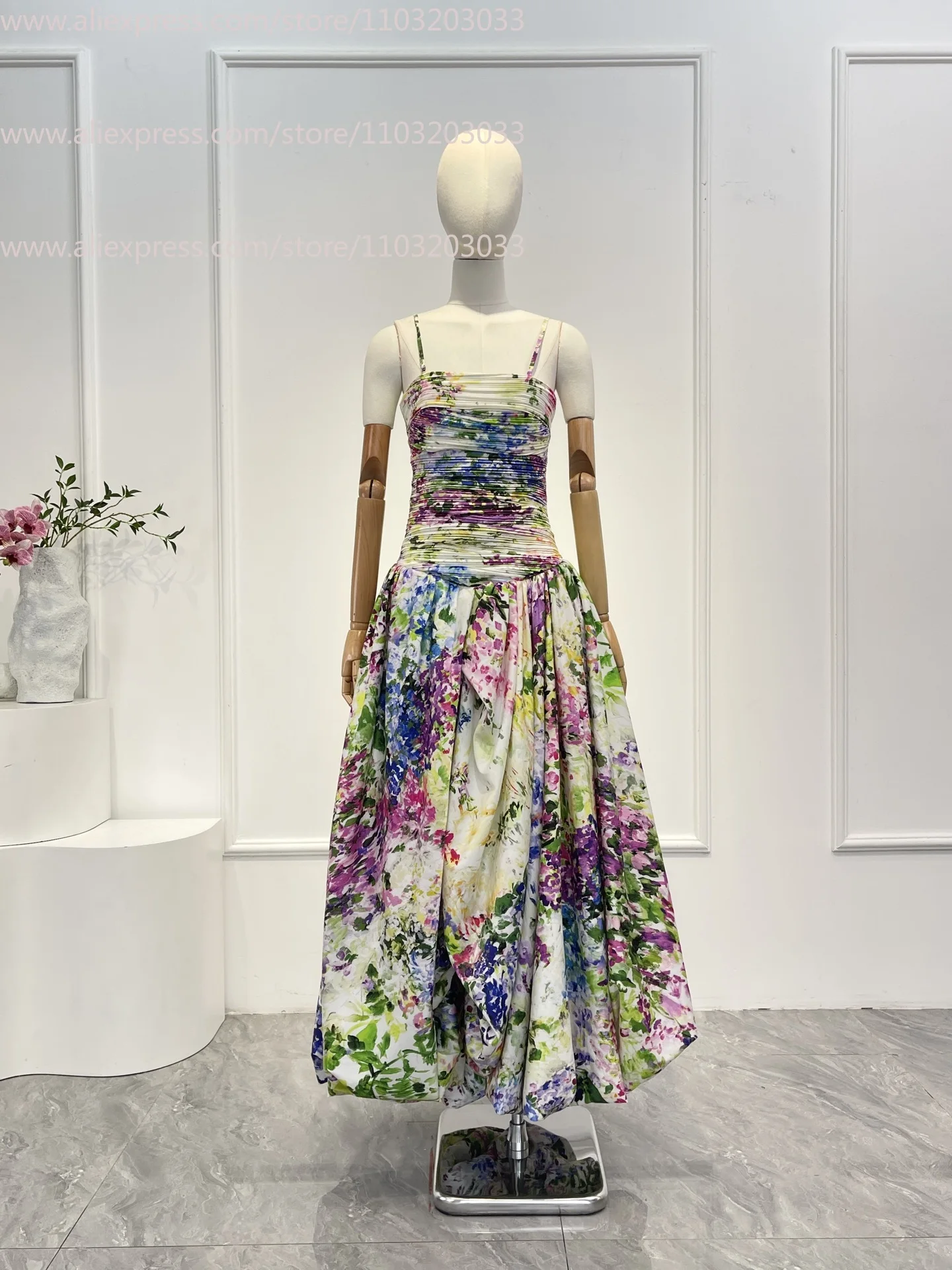 เดรสทรงเอไลน์สีเขียวลายดอกไม้พิมพ์ลายจีบระบายแขนกุดแบบใหม่ปี 2026