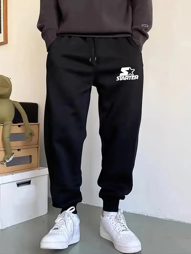 

The new men's trousers for Spring and Autumn 2025 are comfortable soft casual and fashionable featuring letter prints