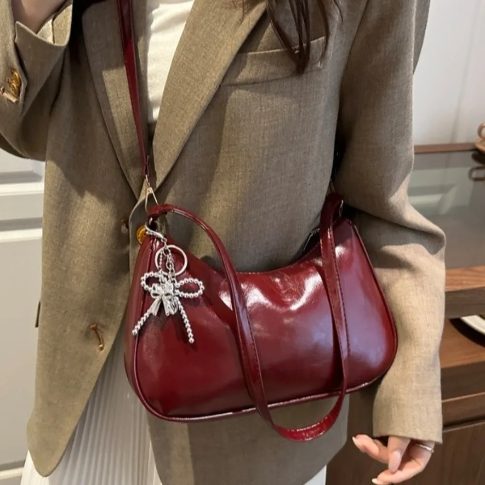 Elegant Oil Wax Leather Crossbody Bag Solid Color Bow Pendant Shoulder Bag Soft Adjustable Thin Strap Crescent Bag Shopping