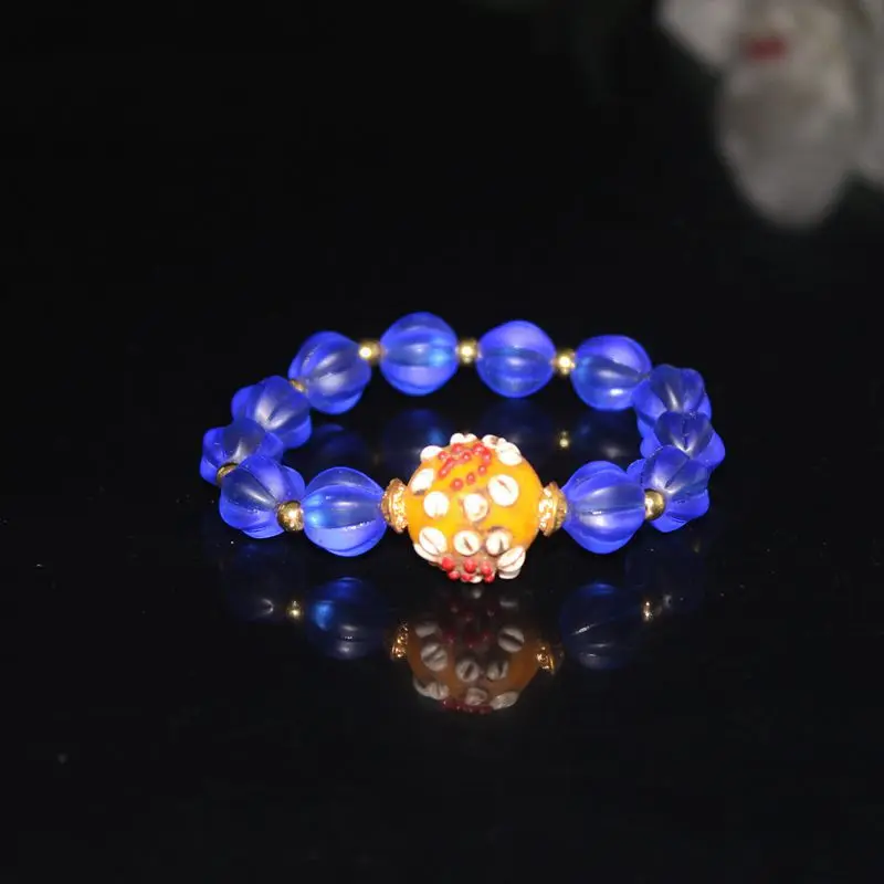 

Голубая морская шелковая дыня с винтажным браслетом из стеклянных цветочных бусин