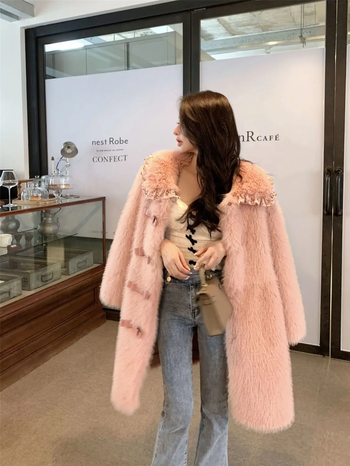 Corea cappotto di pelliccia imitazione di media lunghezza femminile inverno nuovo colletto Peter Pan a maniche lunghe cappotto di pelliccia addensato pelliccia integrata