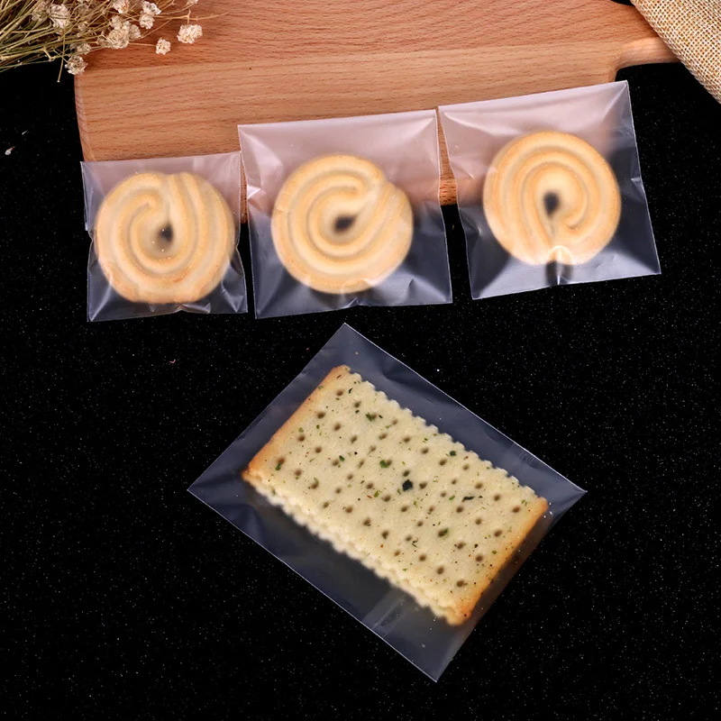 Sacchetto di caramelle in Cellophane traslucido PE da 100 pezzi sacchetto regalo autoadesivo per biscotti caramelle bianche per matrimoni, feste di