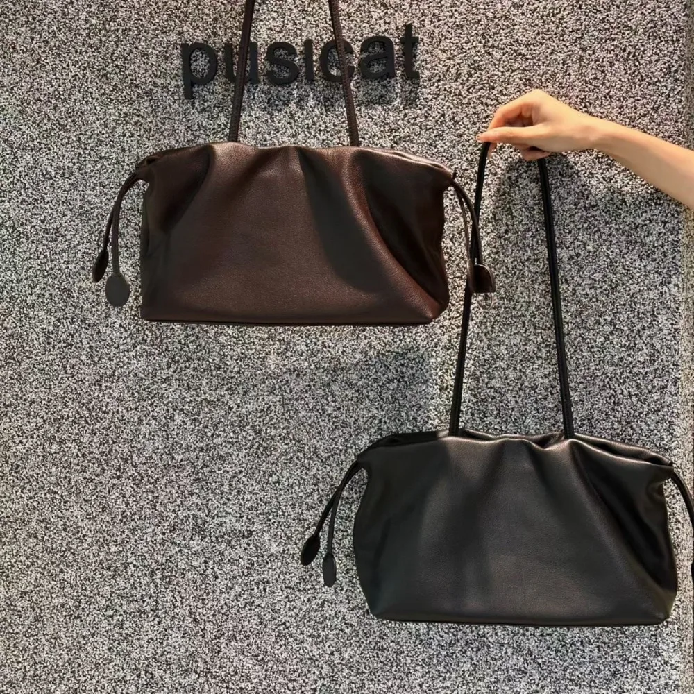 Cowhide Large-capacity Tote Bag Women's Fashion Simple Commuter Leather Shoulder Texture Unique Fashion Niche Design Drawstring