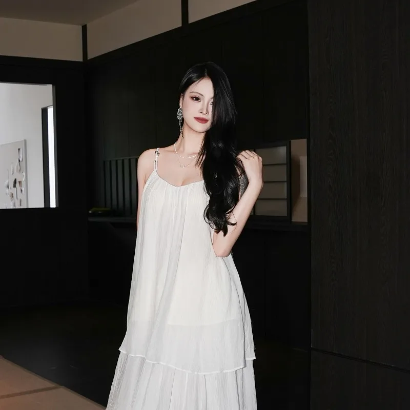 

French Style High-quality Outdoor Vacation Style Women's Loose White V-neck Sleeveless Vest Set Silk Skirt Trendy Two-piece Set