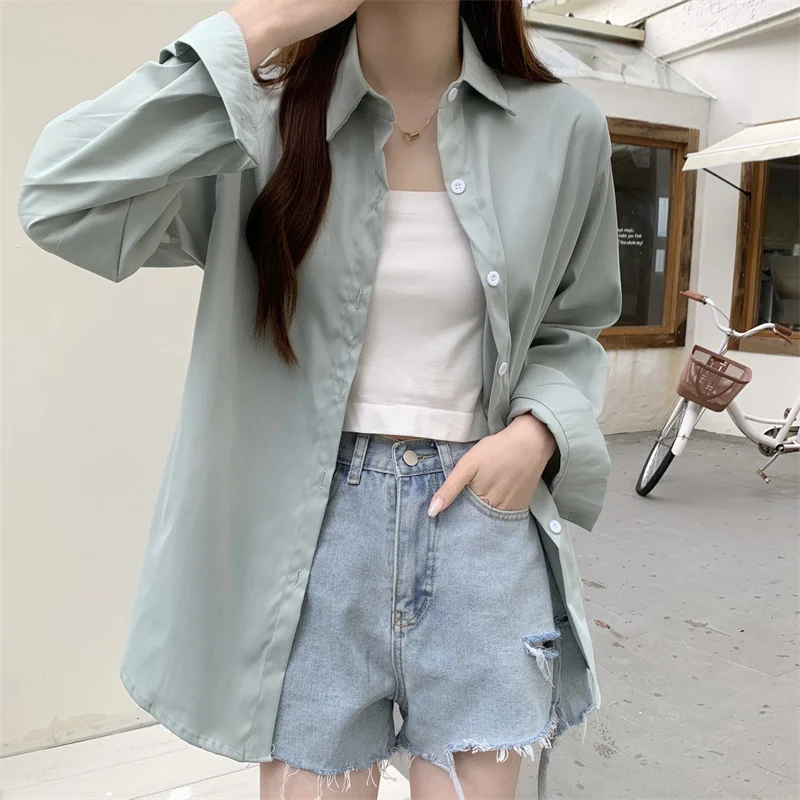 Nueva camisa holgada blanca de manga larga para mujer, estilo francés, Simple, Color sólido, Tops informales de un solo pecho, abrigo fino para primavera y verano