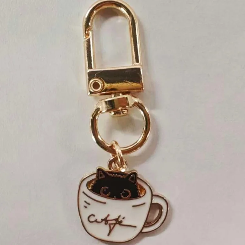 Drip oil alloy teacup cat keychain cup chain pendant earphone pendant small gift (send one randomly)
