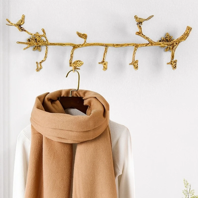 

Brass row hook hanger at home, wall hanging in the entrance, light luxury wardrobe, branch type clothes and hats hook