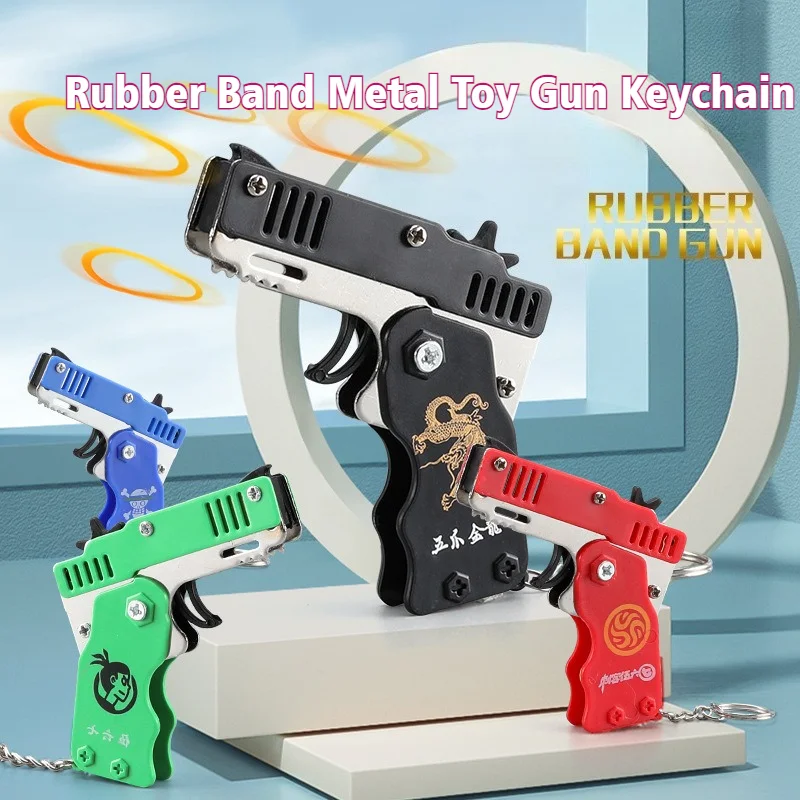 

Rubber Band Gun Kids Toys Cool Keychain Mini Metal Folding Shooting Pistol Rubber Launcher Toy Gifts with 60 Elastic Decorations