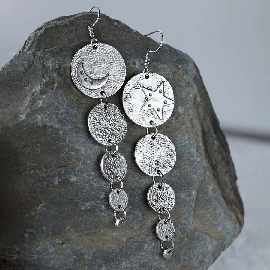 A pair of vintage Bohemian style sun and moon long earrings, asymmetrical metal round sheet handmade earrings