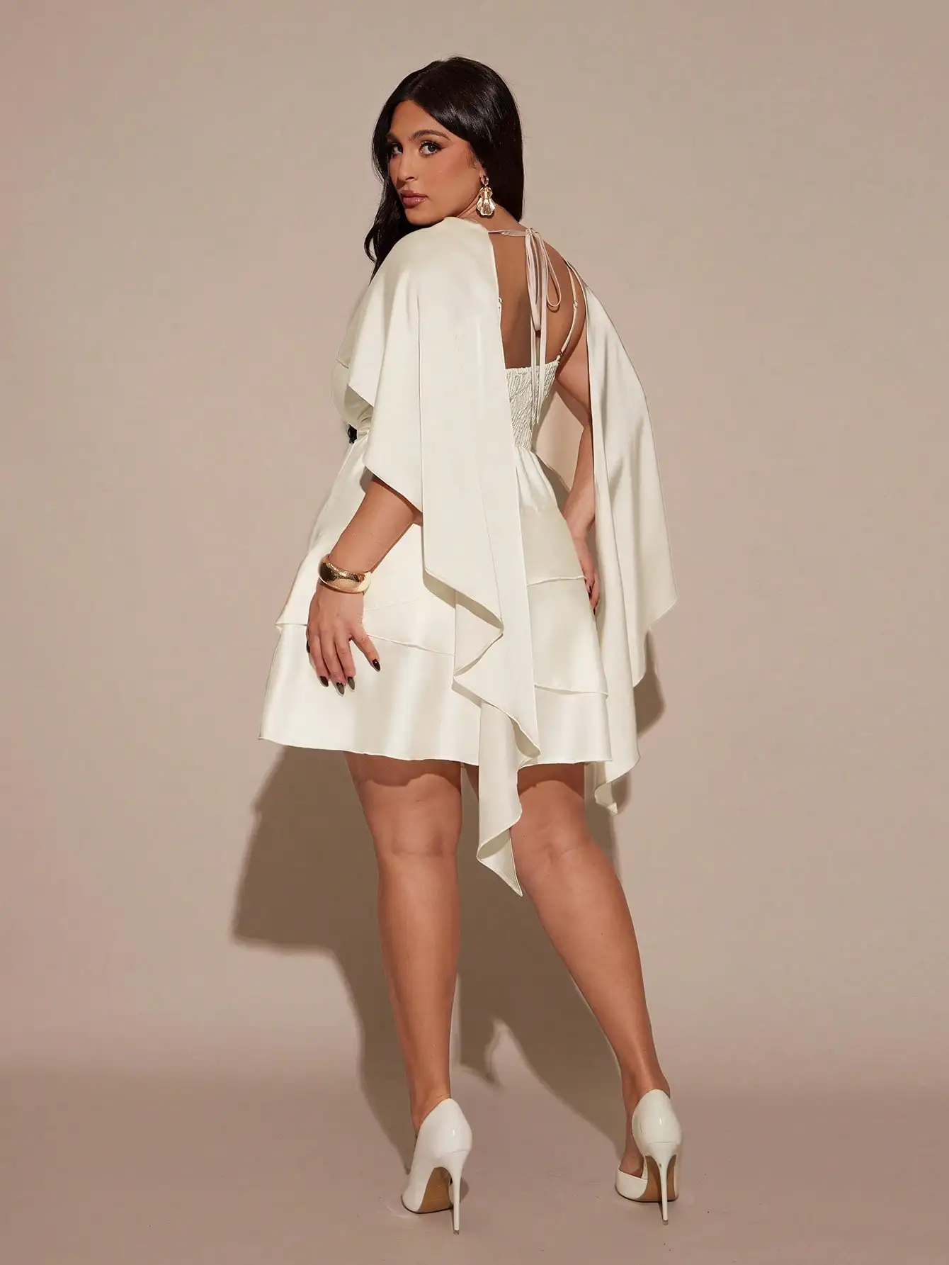 

Ivory Satin Mini Dress with Cape Sleeve and Ruffle Hem, Back Tie Detail