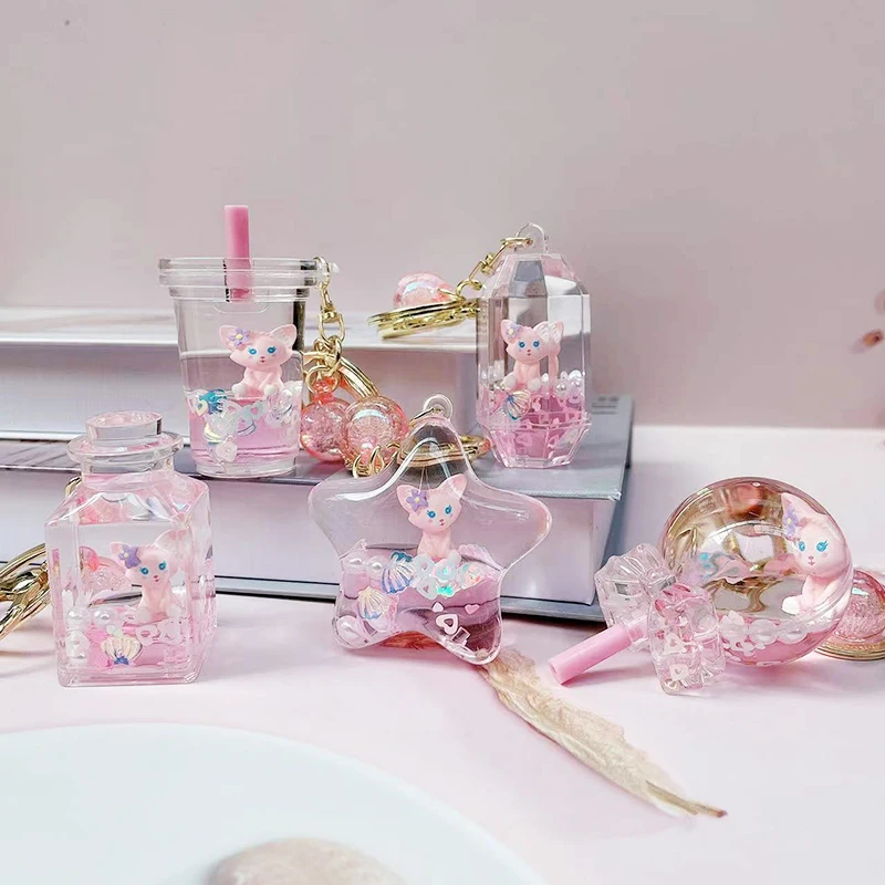 سلسلة مفاتيح كرتونية إبداعية ولطيفة لشخصية لينا بيل، تطفو في سائل زيت ورمل، زينة معلقة، هدية عيد ميلاد، مصنوعة من مادة الأكري...