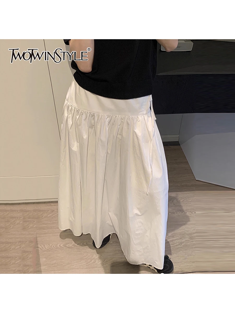 

TWOTWINSTYLE Solid Loose Spliced Folds Casual Skirts for Women High Waist Patchwork Lace Up Minimalist Skirt Female Clothing New