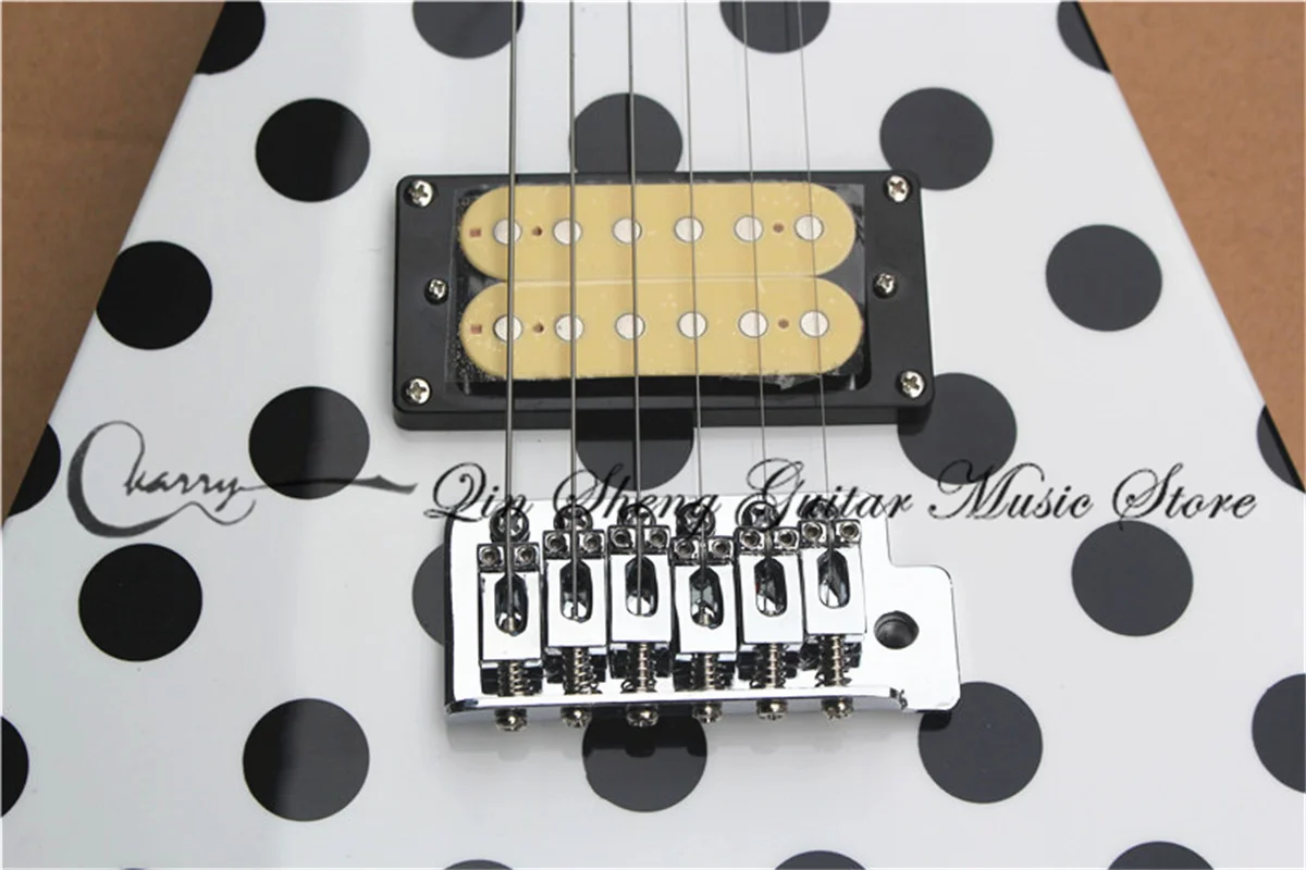 6 strings electric guitar, alien irregular white guitar,tremolo bridge HH pickups,black buttons,mahogany body