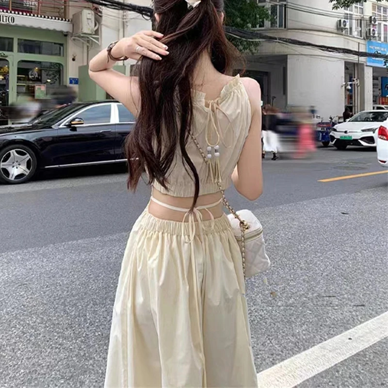 Fashion and Casual Summer Halter Hollow Sleeveless Tassel Solid Color Simple and Generous Hem Holiday Beach Women\'s Long Dress