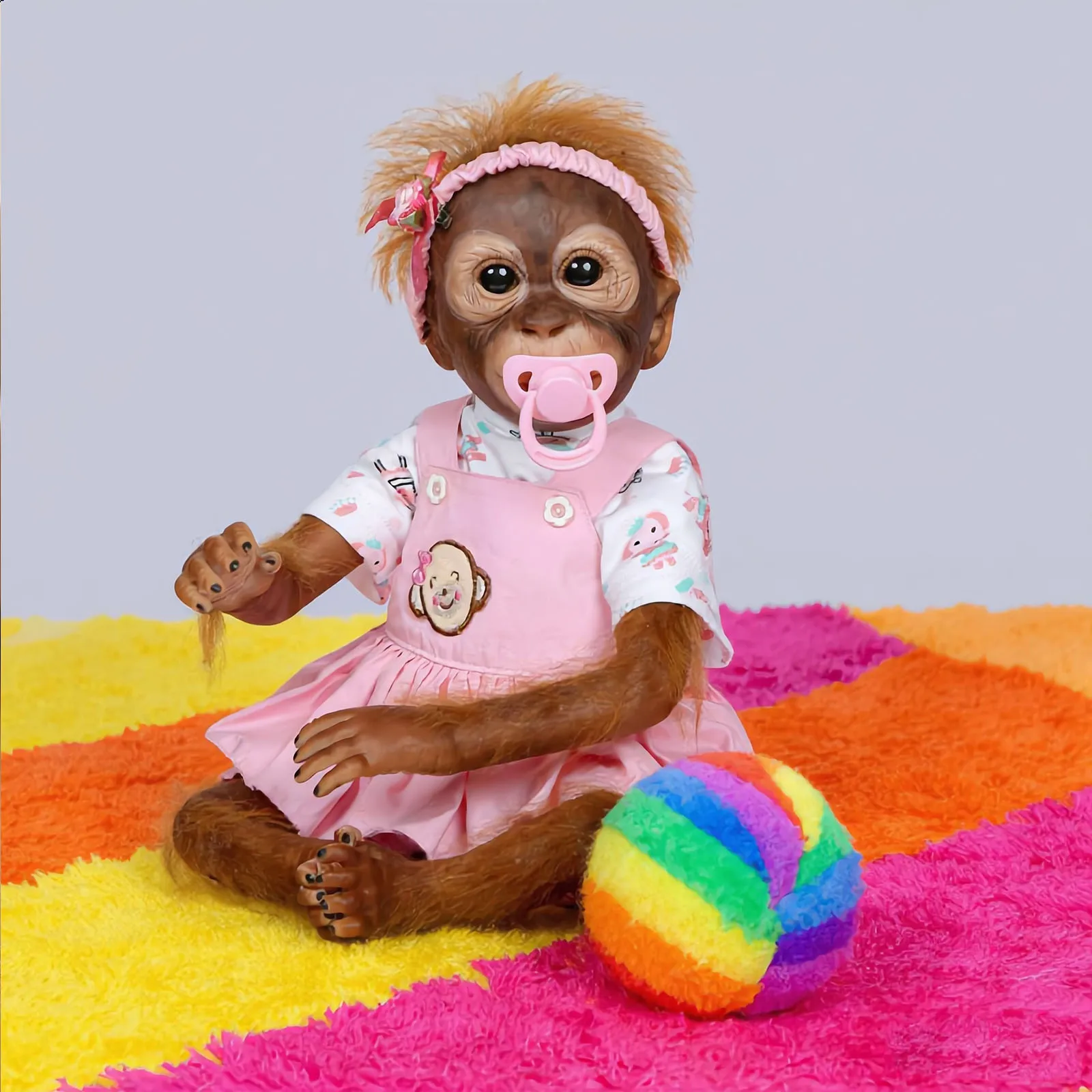 Reborn Affenpuppen 22 Zoll Mädchen, Realistische Orang-Utan Reborn Babypuppe mit Rosa Outfit, Schnuller & Plüschbegleiter, Lebensechte Weichkörper-Reborn-Primatepuppe, Einzigartiges Geschenk für