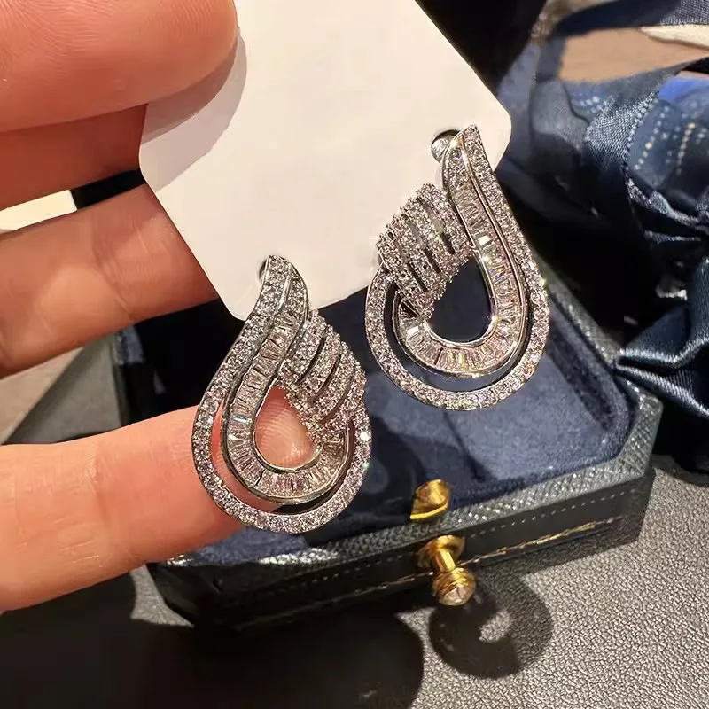 High end Shein style earrings for socialites, featuring female water droplet hollow design, with a light luxury urban trend
