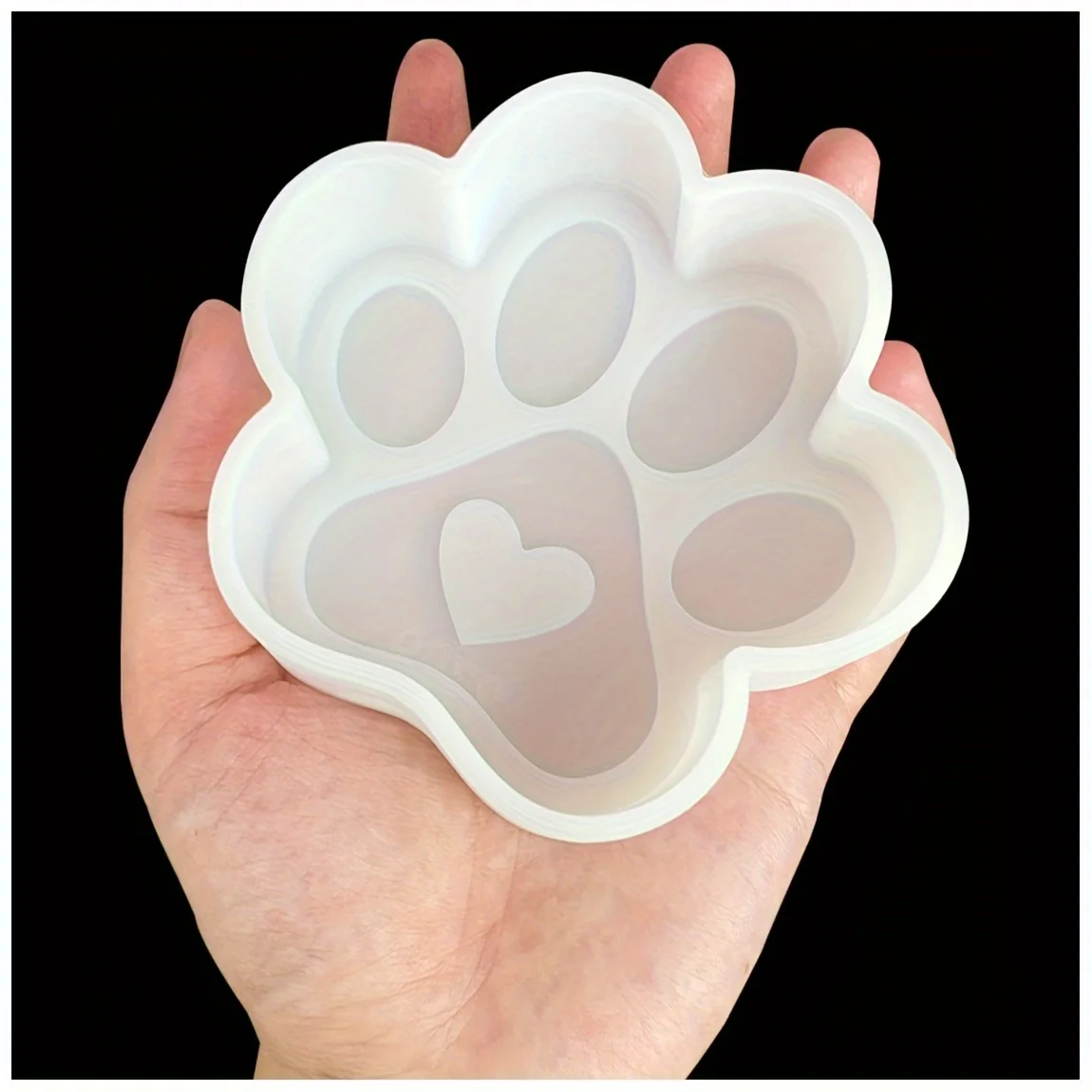 Silicone mold in the shape of a heart-shaped cat paw with holes, designed for making scented stones, scented beads, soap