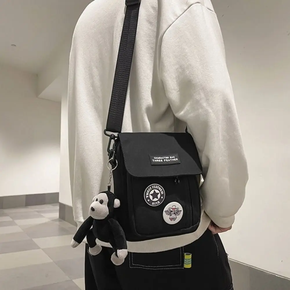

Solid Color Streetwear Mens Crossbody Bag Black Letter Shoulder Bag Casual Zipper Canvas Flap Bag Male