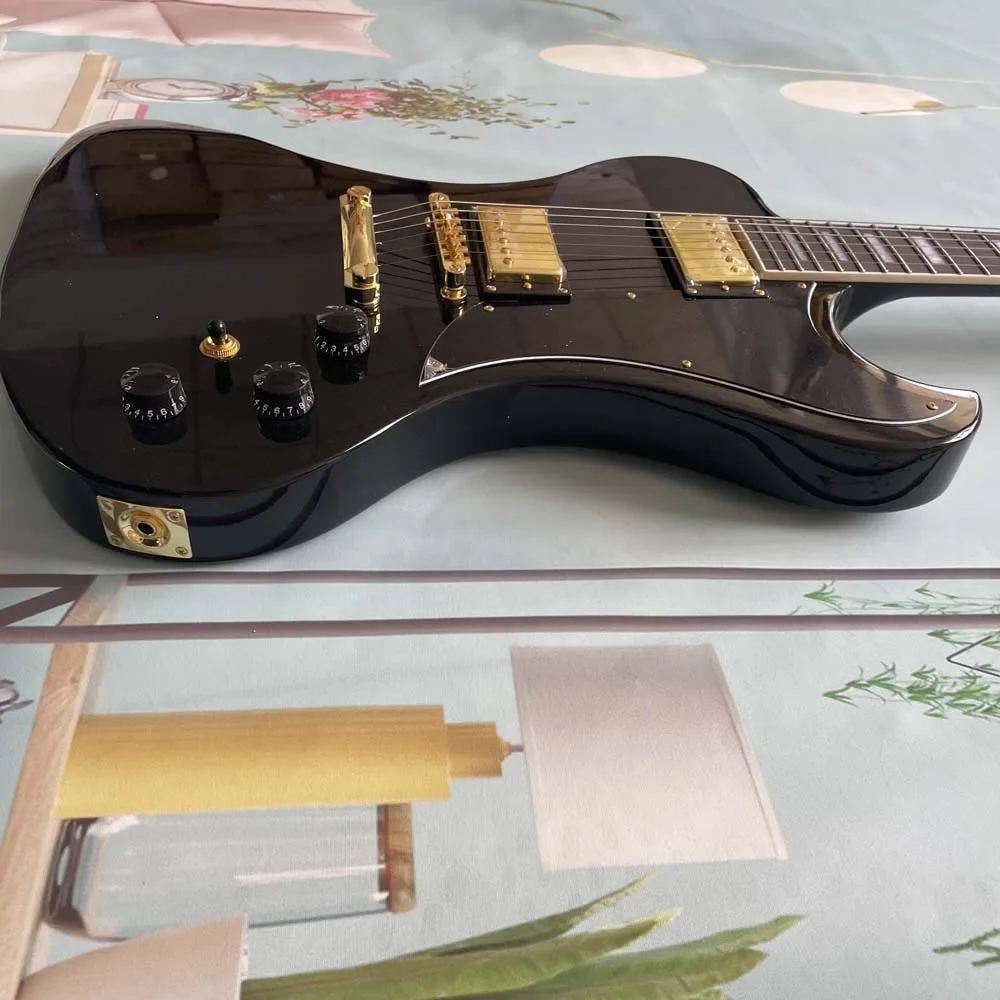 Gloss black irregular electric guitar, gold hardware, dual pickups, rosewood fretboard, hard rock