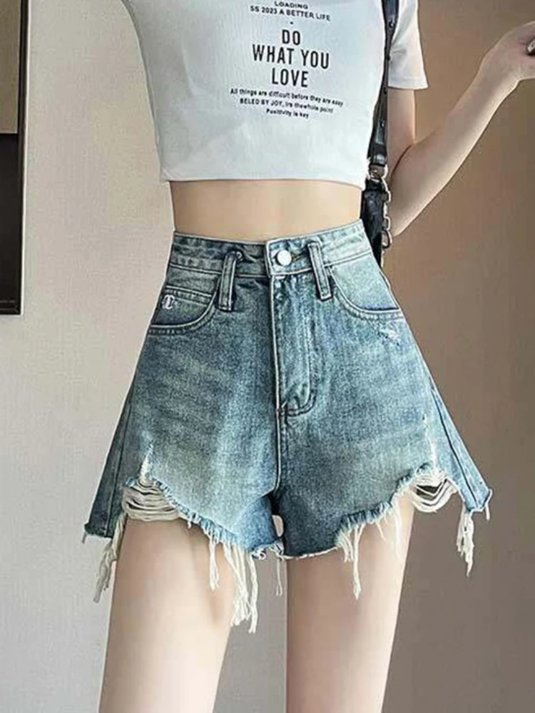 

Female fringed niche design sense shorts summer new thin high waist spicy girl A-line ripped denim wide leg hot pants