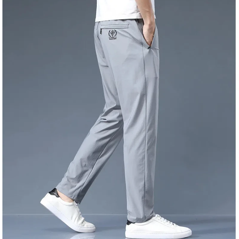 Pantaloni casual elastici da uomo in seta di ghiaccio pantaloni sottili versatili di moda aziendale pantaloni da uomo traspiranti ad asciugatura rapida