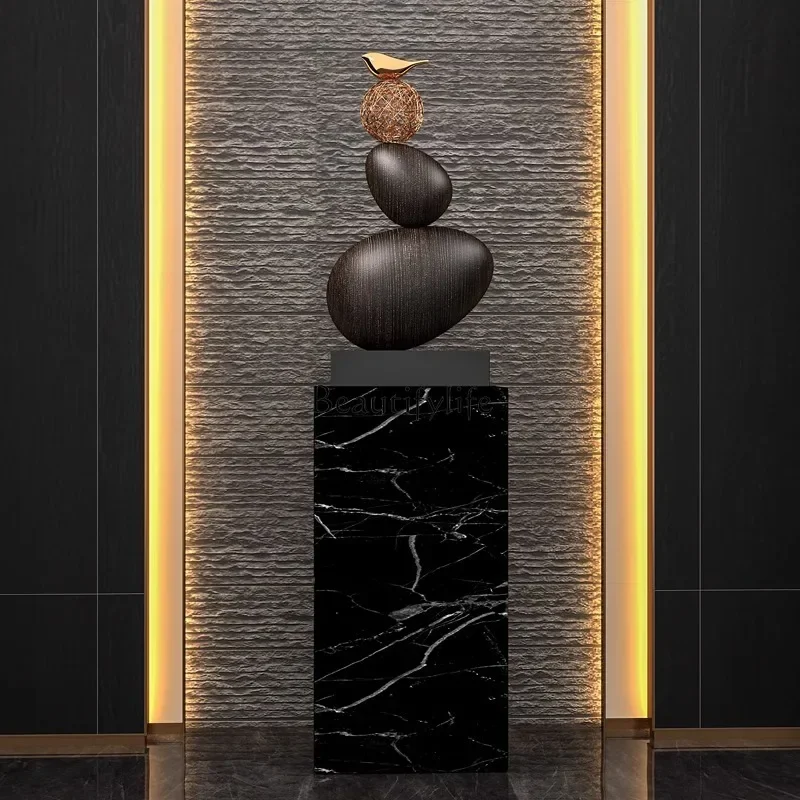 

stone high-end ornaments, large sculpture hotels next to the floor-to-ceiling sofa in the living room, high-end soft ornaments