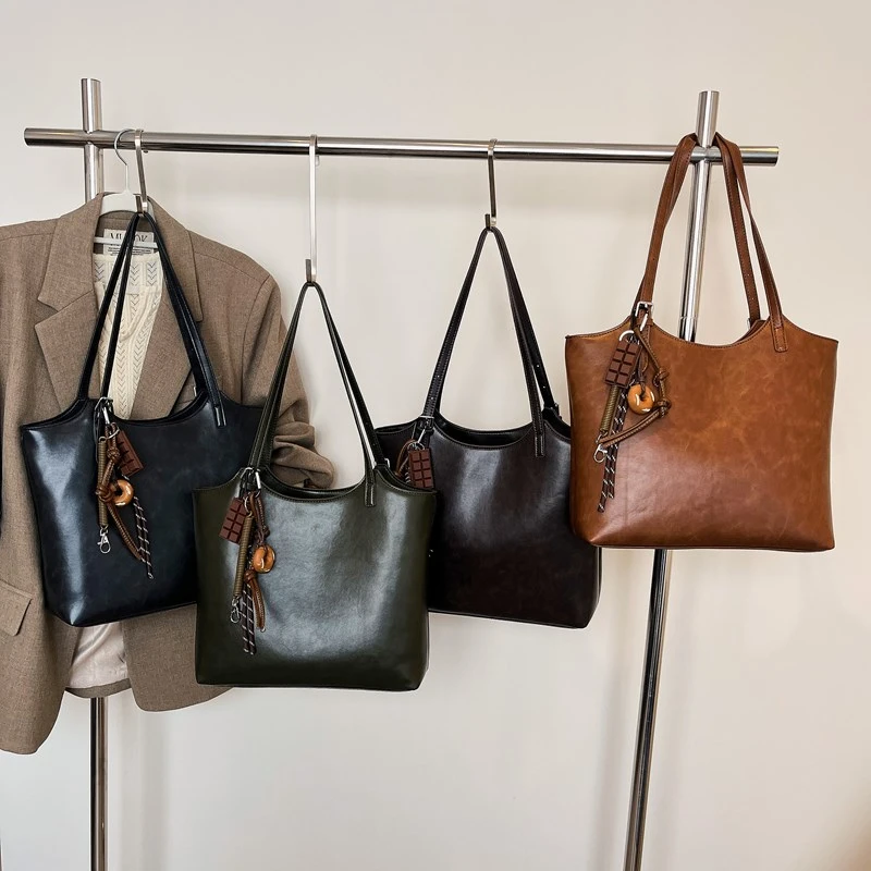 Bolso de hombro de diseñador de alta calidad con cremallera de PU, bolso de moda Popular de Color sólido, bolso de mano de moda Simple suave de gran capacidad 2024