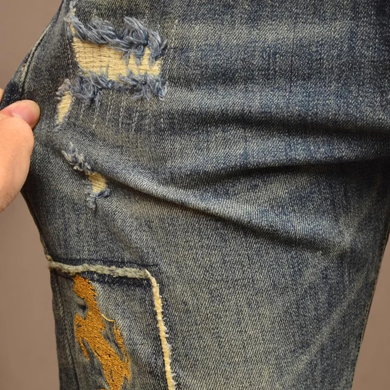 Jeans da uomo street fashion con vestibilità elasticizzata e slim, jeans ondulati, designer di ricami da uomo, stretch hip-hop retrò blu de