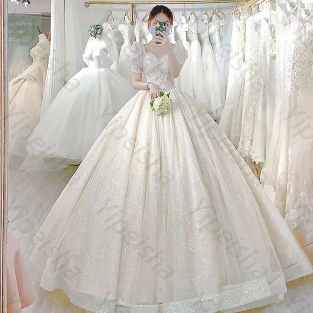 Customized Luxury Trailing Chiffon Sparkling Wedding Dress 2026 Bubble Sleeves Square Neck Fluffy Bridal Gown Suitable for Beach