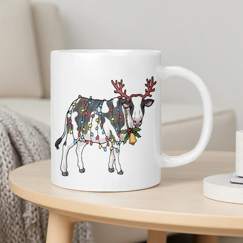 This ceramic mug features a Christmas cow, reindeer antlers, and fairy lights design, perfect for home, office, and everyday use