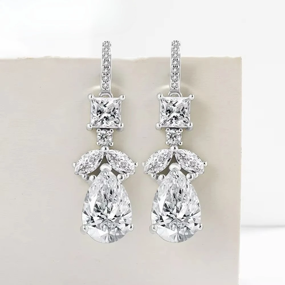Luxury semi-gold 925 sterling silver crystal earrings, plated with 18K gold and set with multiple diamonds as the ear pendants.
