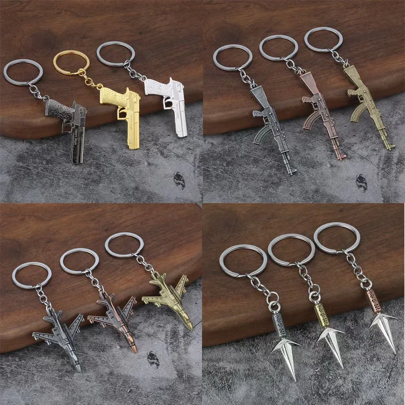 

100pcs/Lot Metal 3D Gun Keychain Warcraft Keyring Dart Key Chains Machine Gun Key Rings Games Weapon Pendant