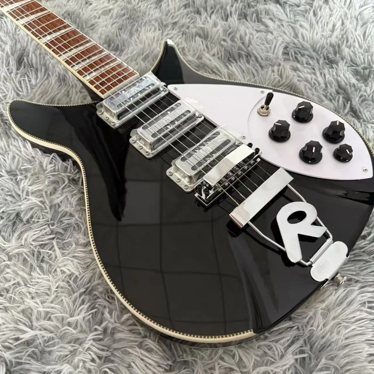 High-quality Rickenbacker 350 Black Electric Guitar, 6-String Guitar, Featuring a Premium R-Shaped Tailpiece.