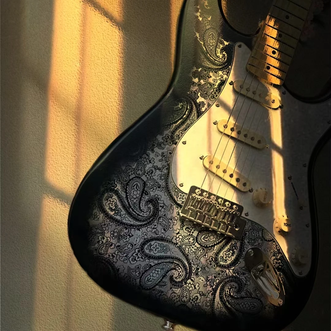 Heirloom coral electric guitar, Paisley gray decal