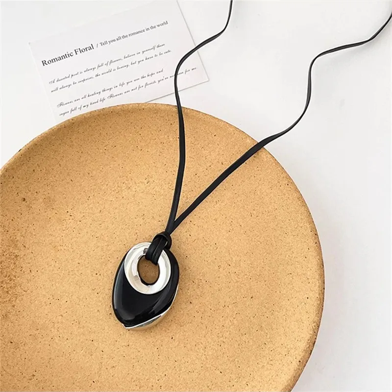 Retro light luxury black agate round leather rope long necklace female niche design irregular pendant sweater chain tide