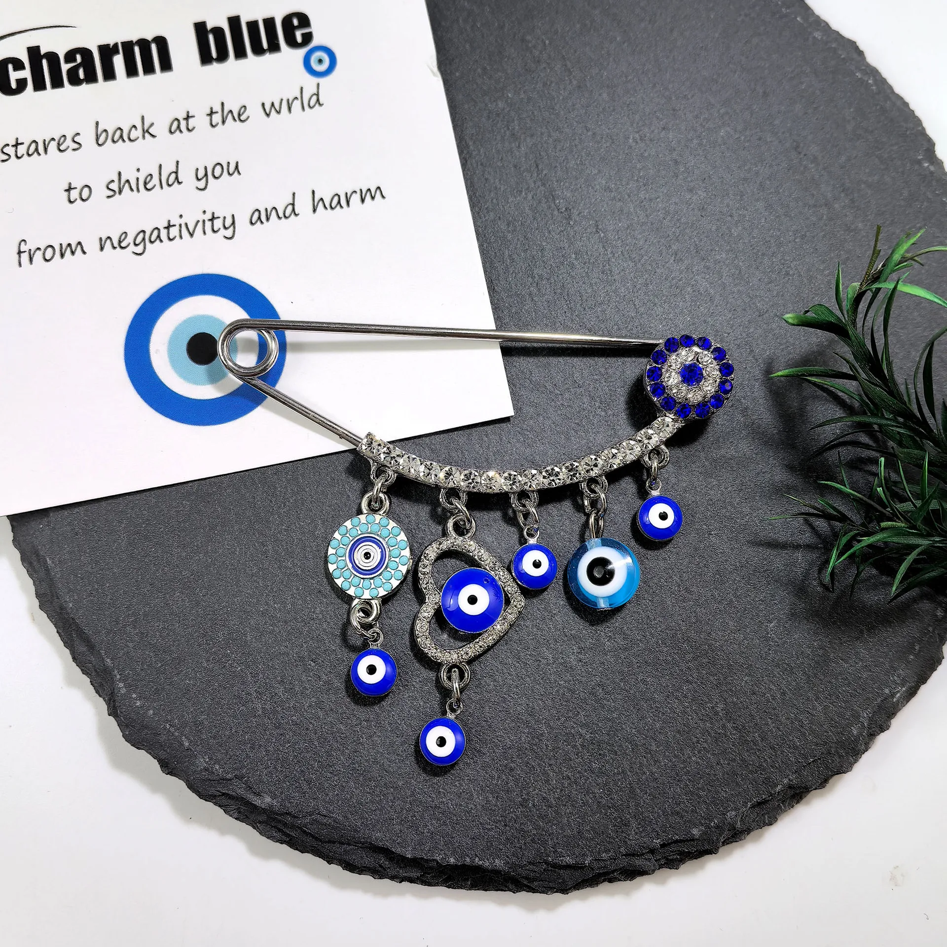 Cross border creative high-end blue eye sweater pin decoration, diamond studded devil's eye tassel brooch