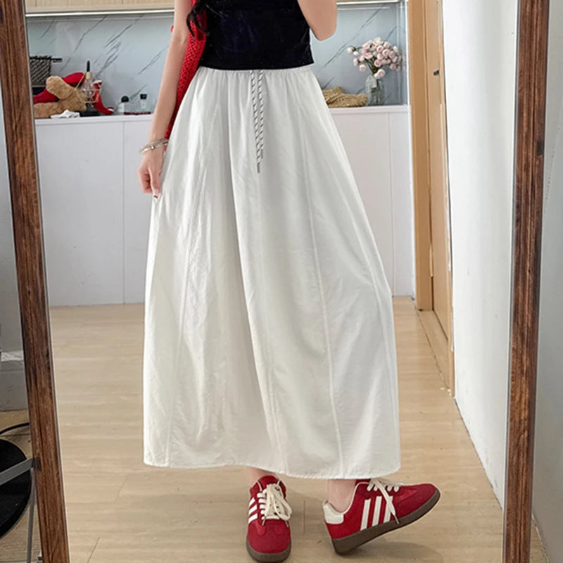 تنورة نسائية صيفية من الحرير الجليدي لعام 2025 بخصر مطاطي كوري تنانير طويلة على شكل حرف A للسيدات بأربطة ملابس خروج رفيعة تنانير نسائية