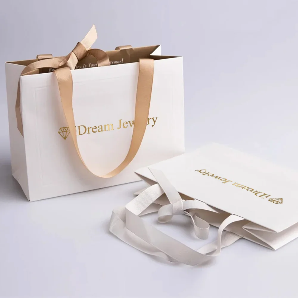 Bolsa de embalaje de joyería y cosméticos Premium con estampado de logotipo personalizado, bolsas de papel para compras de regalo Kraft de lujo con asas