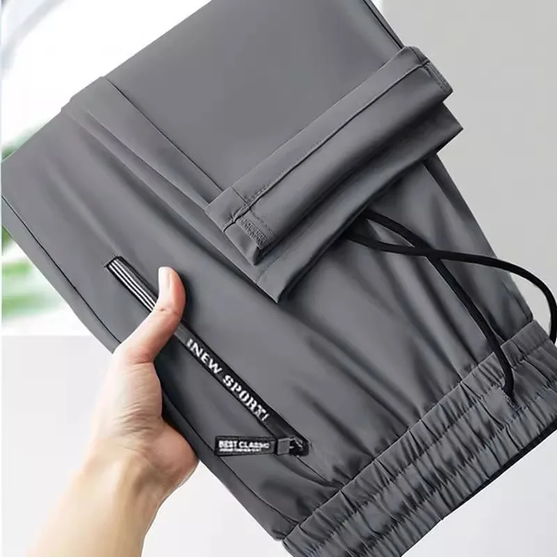 Pantaloni da lavoro estivi da uomo in seta di ghiaccio sottile Pantaloni sportivi casual in vita elastica con pantaloni lunghi a gamba dritta per giovani