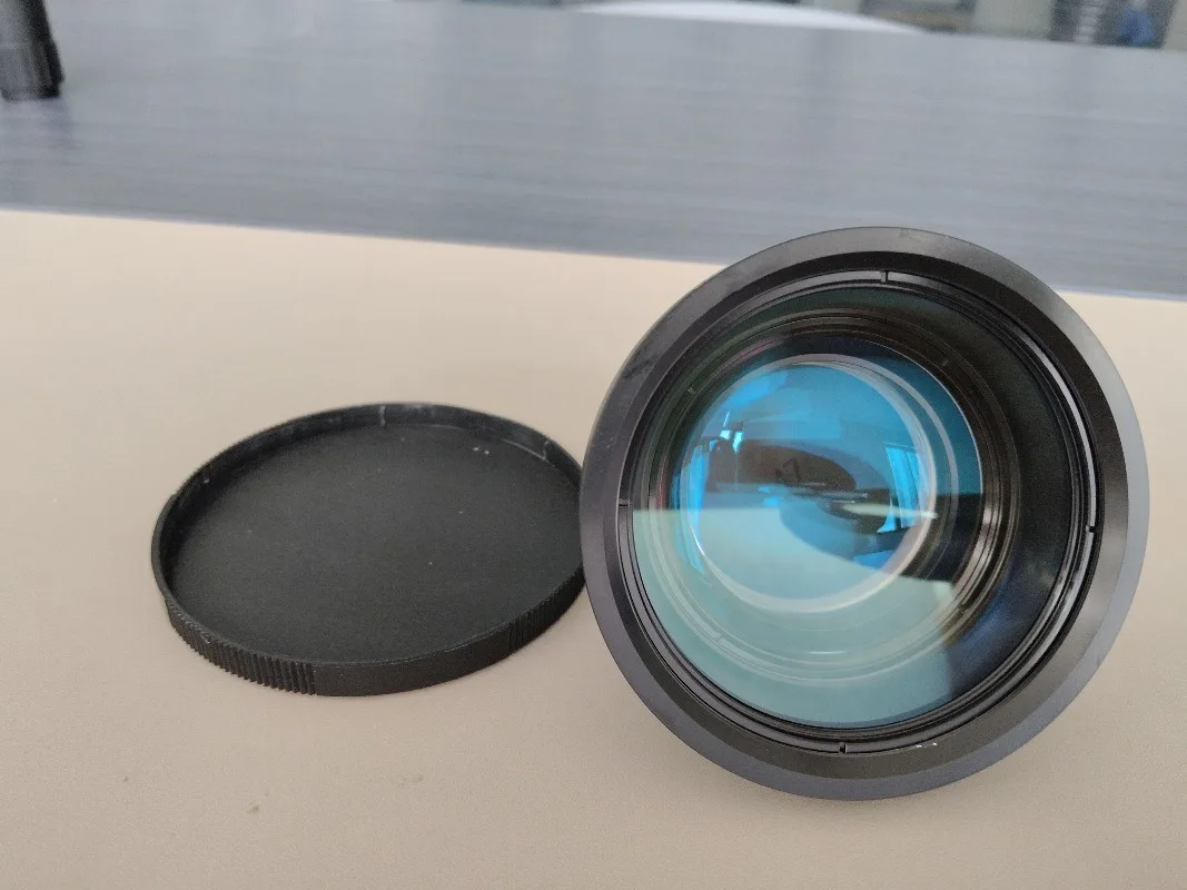 Pezzi di ricambio per apparecchiature Lente di messa a fuoco Lunghezza d'onda 355nm F-theta Lente di messa a fuoco UV Prezzo Lente da campo in fibra per pennarello UV